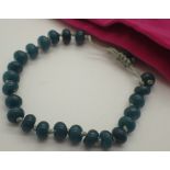 Dark green jade hand knotted bead bracel