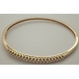 9ct gold diamond bangle set with ninetee