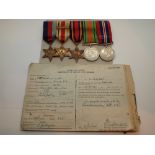 Five WWII medals including Africa Star with clasp and paperwork attributed to LG Haydon