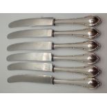 Six 800 silver handled knives