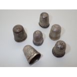 Five hallmarked silver thimbles and one other mixed assay and makers marks