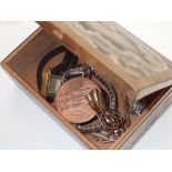 Snakeskin and brass box containing wristwatches