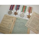 Four WWII medals and paperwork for KC Marshall