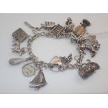 Sterling silver vintage charm bracelet with assorted vintage silver charms fully hallmarked to