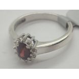 Silver garnet and diamond ring stamped 925 DIA size O