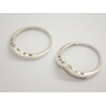 Two silver wishbone rings stamped 925 cubic zirconia size P 3.