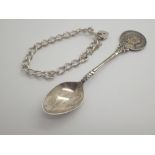 Silver bracelet and a 1935 Silver Jubilee spoon from Lord and Lady Daresbury