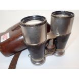 Pair of leather cased unmarked military style binoculars