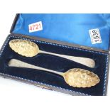 Matched pair of silver George II berry spoons in a fitted box