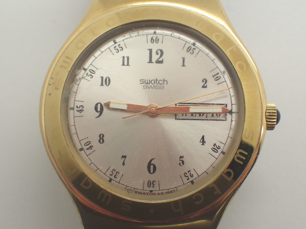 1997 Swatch day and date wristwatch CONDITION REPORT: This item is working at