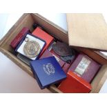 Wooden pencil box containing assorted medals 1920s - 1950s including RADA