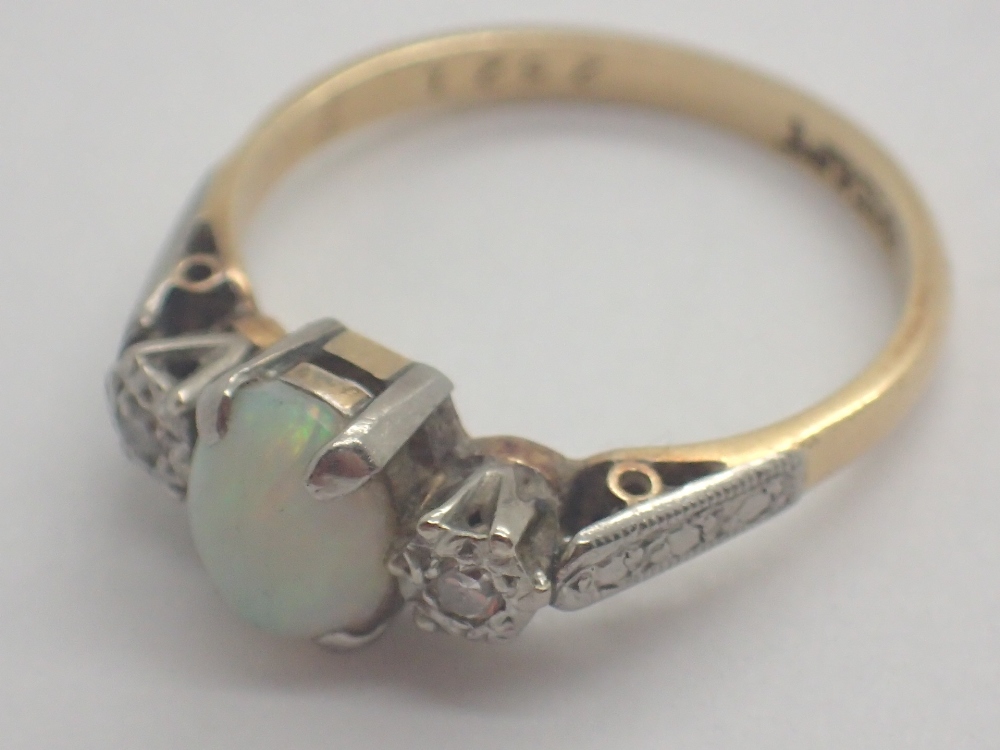 18ct yellow gold opal and diamond set ring 2.