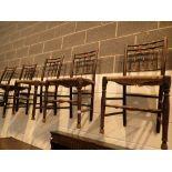 Four stickback antique rush seated chairs and a rocking example