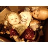 Box of mixed vintage dolls including ceramic headed examples with some clothing all A/F