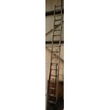 Pair of extending aluminium ladders approximately 15 to 30ft with stand off and a pair of blue 6ft