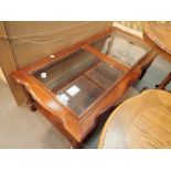 Long coffee table with two inset glass panels and rattan lower shelf 117 x 54 cm