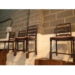 Four ladder back dining chairs in dark oak with pink velour seats