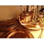 Shelf of brass and copper items including two kettles candlesticks bed warmer etc