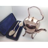 Silver plated spirit kettle with paw feet ivory knop and burner and a pair of cased silver plate