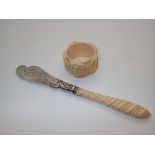 Hallmarked silver blade and mount ivory handled Victorian butter knife and an antique carved ivory