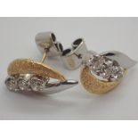 14ct gold fancy yellow and white gold diamond stud earrings approximately 0.