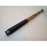 Leather bound brass Ghillies three draw spotting scope by L Odell Goodall of London L: 16 cm closed