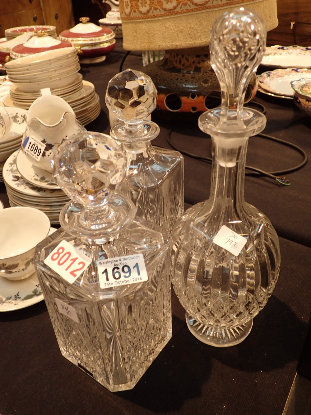 Three cut glass crystal decanters