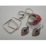 Three silver rings and two pairs of silver earrings