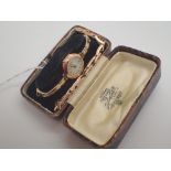 Two 9ct yellow gold Art Deco style circular ladies wristwatches with two rolled gold expanding
