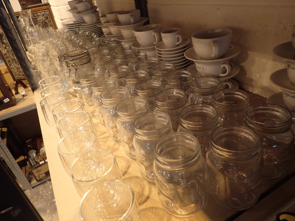 Two shelves of caffelatte cup saucers plates glasses and kilner jars - Image 2 of 5