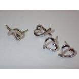 Two pairs of silver heart stud earrings