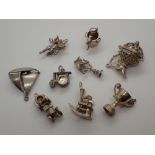 Ten various silver charms