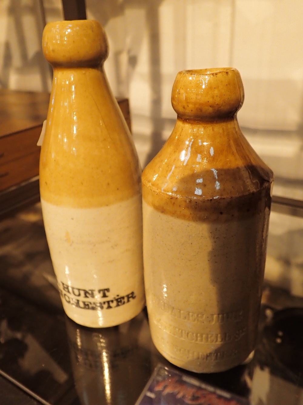 Two stoneware ginger beer bottles