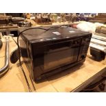 Modern 700W black microwave CONDITION REPORT: The electrical items included in this