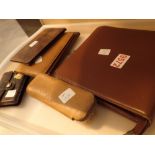 Tray of leather wallets brush and notebook holder