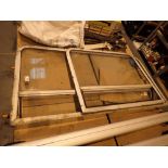 Two narrow boat side windows with opening top vent