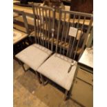 Matching pair of steel framed dining chairs with upholstered seats