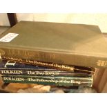 Fourth edition hardback copy of JRR Tolkeins The Hobbit and a set of three paperback Lord of the