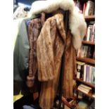 Three furs including mink coat fox cape and one other