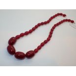 Cherry amber bead necklace largest bead 2.5 x 1.