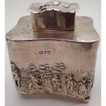 Hallmarked silver tea caddy relief decorated with figural scenes to the body and cover assay