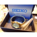 Boxed yellow metal Seiko wristwatch with day date and papers