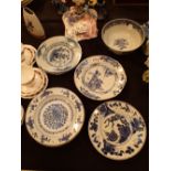 Set of four porcelain plates painted in underglaze blue with flowers Kangxi double ring and seal