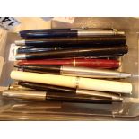 Box of mixed fountain and ballpoint pens