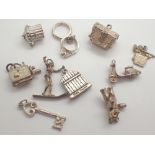 Ten various silver charms