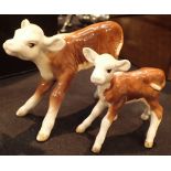 Two Beswick calves large and small