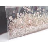Quantity of mixed clean and polished diamonds largest two approximately 0.