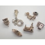 Eight various silver charms