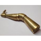 Brass match striker in the shape of a leg possibly Georgian