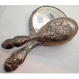 Hallmarked silver cherubs brush and mirror